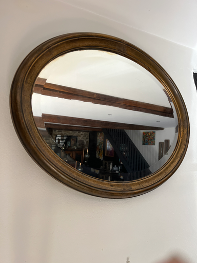 Miroir, forme ovale en bois patiné